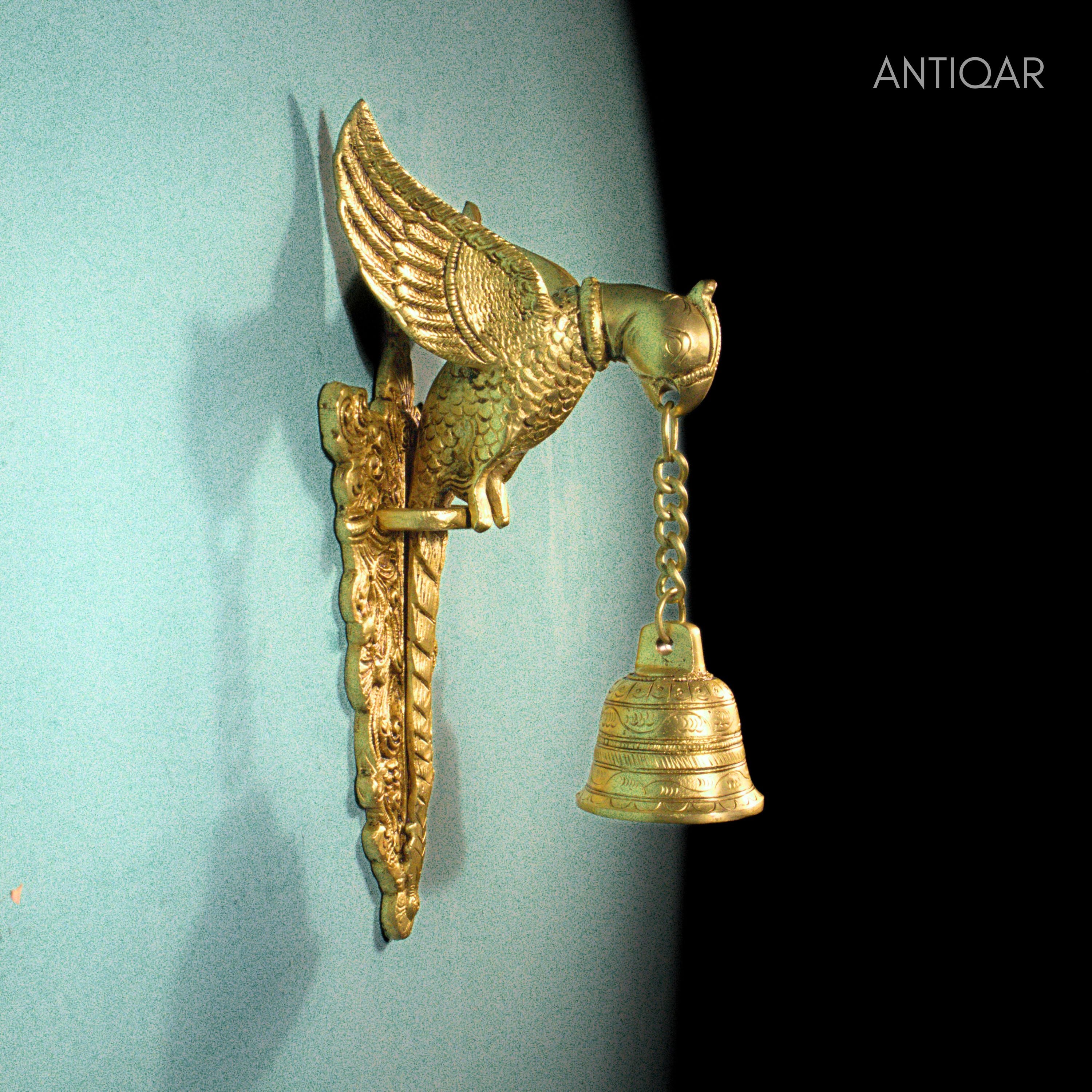 Brass Parrot Wall Hanging – 26 cm | Sitting on Tree Holding Designer Bell | Antique Golden Finish | Handcrafted Decor for Temple, Home & Wall