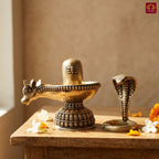 Brass Shivling with Detachable Sheshnaag – 8cm | Golden Finish | Spiritual Idol for Temple & Home Decor