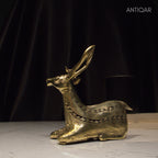 Dhokra Art Brass Deer – 17.5 cm | Sitting Pose in Antique Finish | Tribal Handcrafted Showpiece for Temple, Home & Table Decor