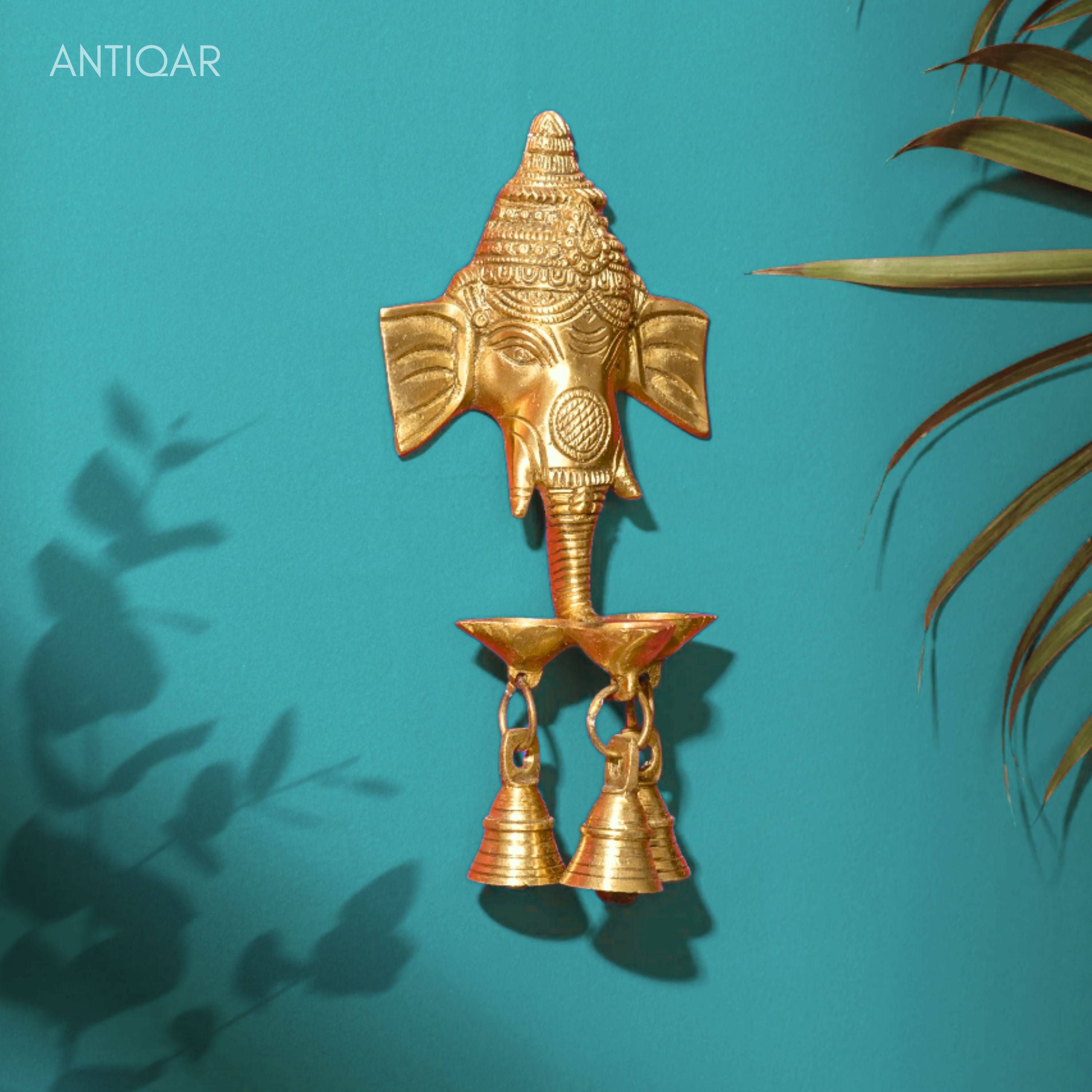 Brass Ganesh Head Wall Hanging – 23 cm | With Diya & Three Bells | Antique Golden Finish | Handcrafted Spiritual Decor for Temple, Home & Wall