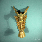 Brass Parrot Wall Hanging – 26 cm | Sitting on Tree Holding Designer Bell | Antique Golden Finish | Handcrafted Decor for Temple, Home & Wall