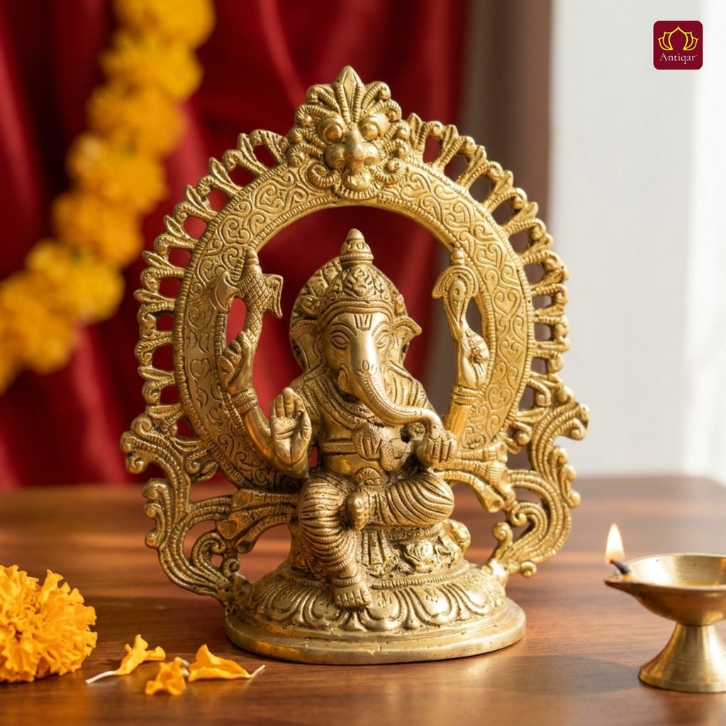 Brass Ganesh Ji Idol with Ornate Frame – 22 cm | Sitting Position with Intricate Carving | Antique Golden Finish | Handcrafted for Temple, Home & Table Decor
