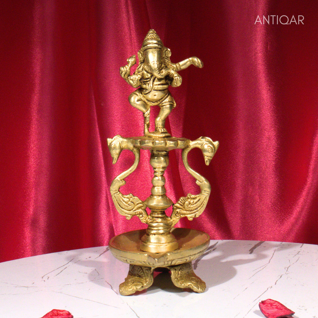 Brass Aarti Diya – 21 cm | Twin Peacock Design with Dancing Ganesha on Top | Antique Golden Finish | Handcrafted for Temple, Home & Religious Decor
