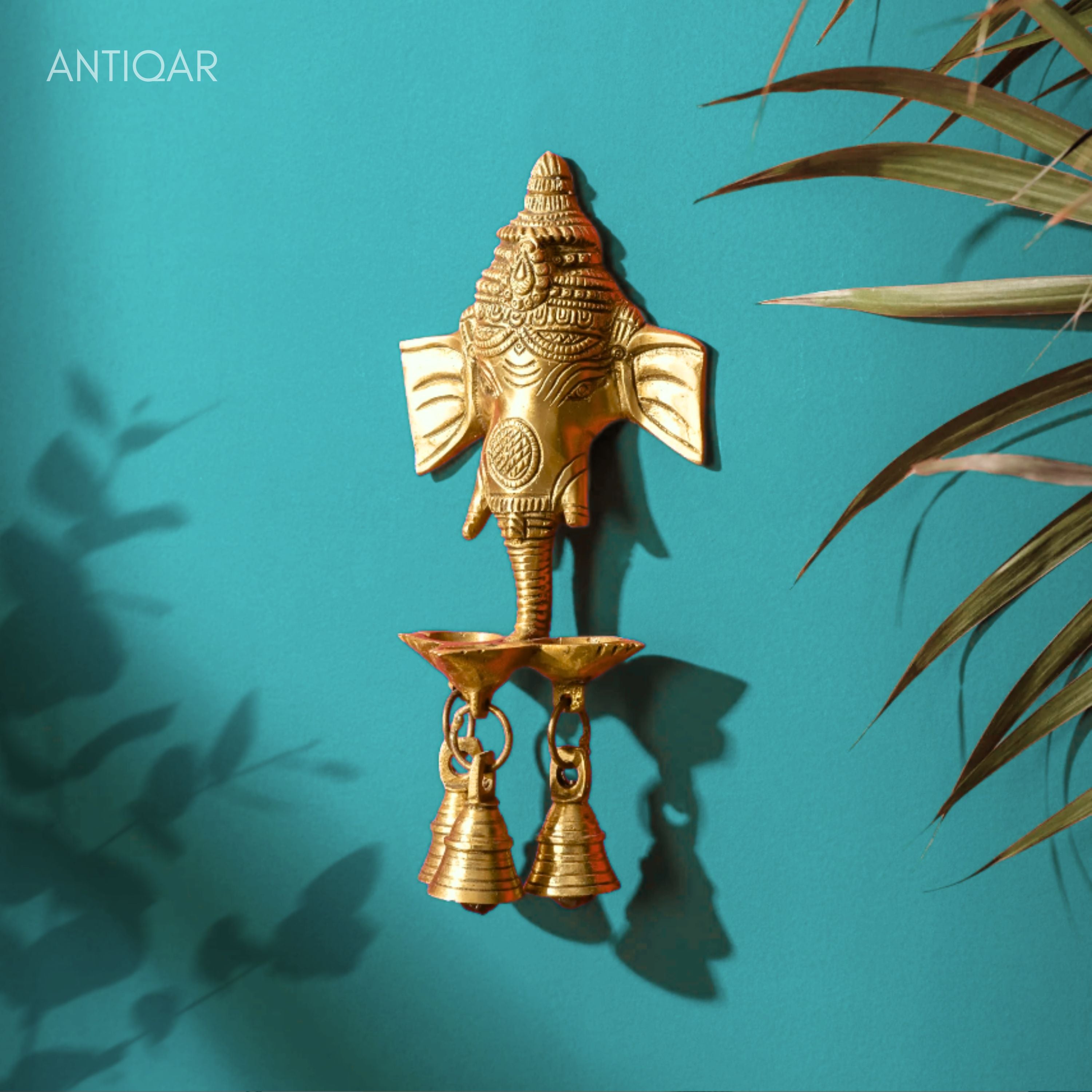 Brass Ganesh Head Wall Hanging – 23 cm | With Diya & Three Bells | Antique Golden Finish | Handcrafted Spiritual Decor for Temple, Home & Wall
