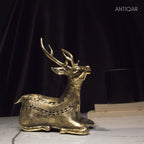 Dhokra Art Brass Deer – 17.5 cm | Sitting Pose in Antique Finish | Tribal Handcrafted Showpiece for Temple, Home & Table Decor
