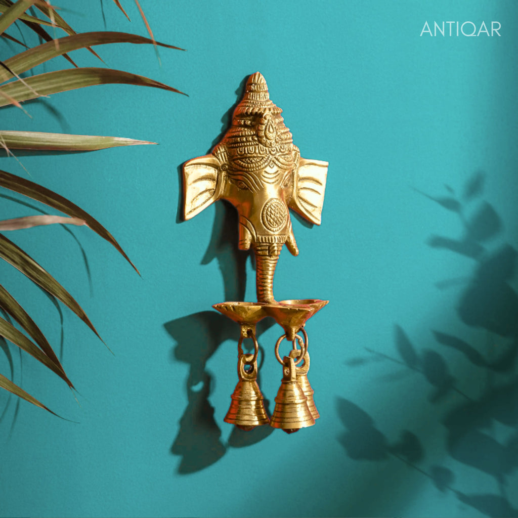 Brass Ganesh Head Wall Hanging – 23 cm | With Diya & Three Bells | Antique Golden Finish | Handcrafted Spiritual Decor for Temple, Home & Wall