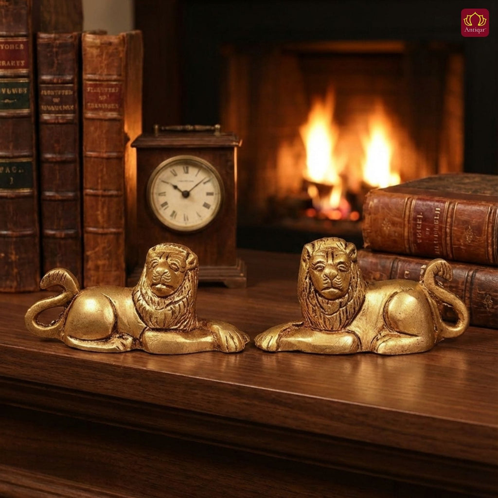 Brass Lion Pair Showpiece – 4 cm | Sitting Position | Antique Golden Finish | Handcrafted Figurines for Home, Table & Vastu Decor