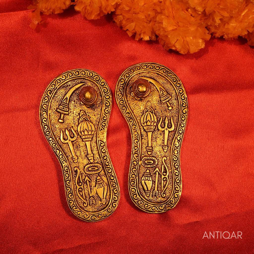 Brass Charan Paduka Pair – 3 cm | With Carved Talwar, Dhanush, Trishul & Chakra | Antique Golden Finish | Handcrafted Spiritual Decor for Temple, Home & Festival Use