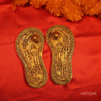 Brass Charan Paduka Pair – 3 cm | With Carved Talwar, Dhanush, Trishul & Chakra | Antique Golden Finish | Handcrafted Spiritual Decor for Temple, Home & Festival Use