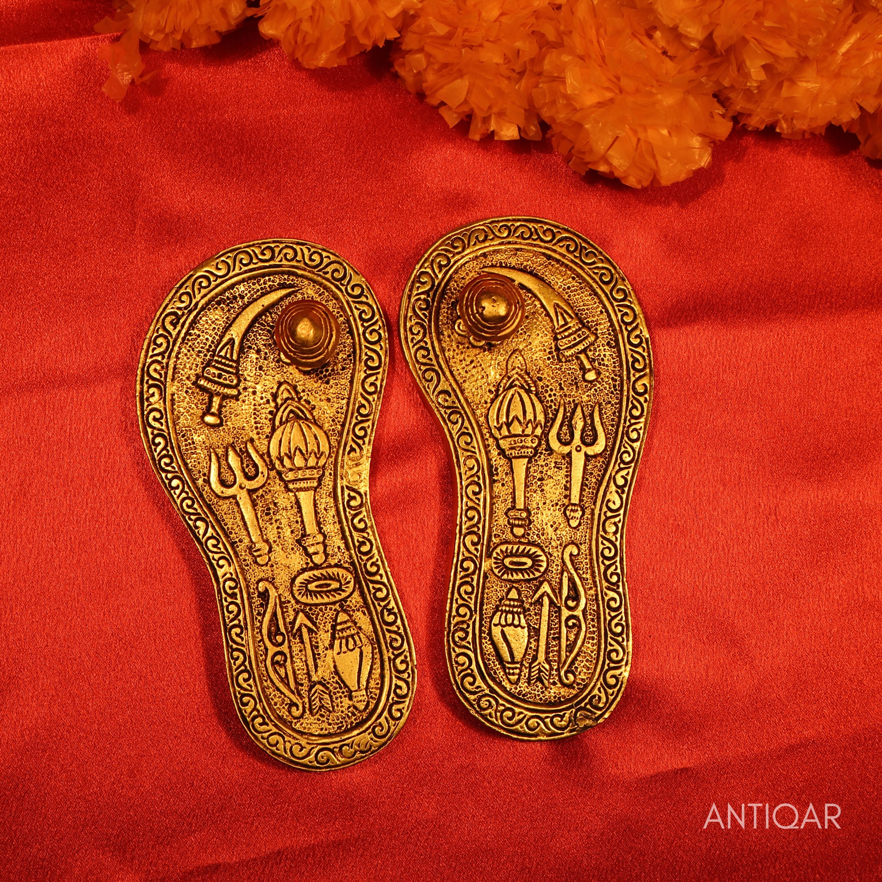 Brass Charan Paduka Pair – 3 cm | With Carved Talwar, Dhanush, Trishul & Chakra | Antique Golden Finish | Handcrafted Spiritual Decor for Temple, Home & Festival Use