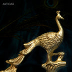 Brass Peacock Showpiece – 21 cm | Sitting on Tree Trunk Design | Antique Golden Finish | Handcrafted Decor for Temple, Home & Table