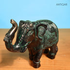 Brass Elephant Showpiece – 9 cm | Walking Pose with Upward Trunk & Carved Body | Black Green Patina Finish | Handcrafted Decor for Temple, Home & Table