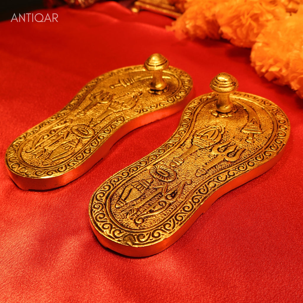 Brass Charan Paduka Pair – 3 cm | With Carved Talwar, Dhanush, Trishul & Chakra | Antique Golden Finish | Handcrafted Spiritual Decor for Temple, Home & Festival Use