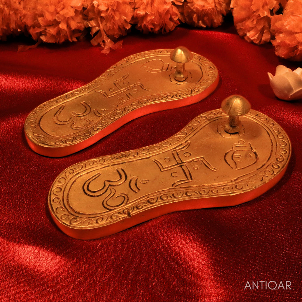 Brass Charan Paduka – 4 cm | With Om & Swastik Carving | Antique Golden Finish | Handcrafted Spiritual Symbol for Temple & Home Decor