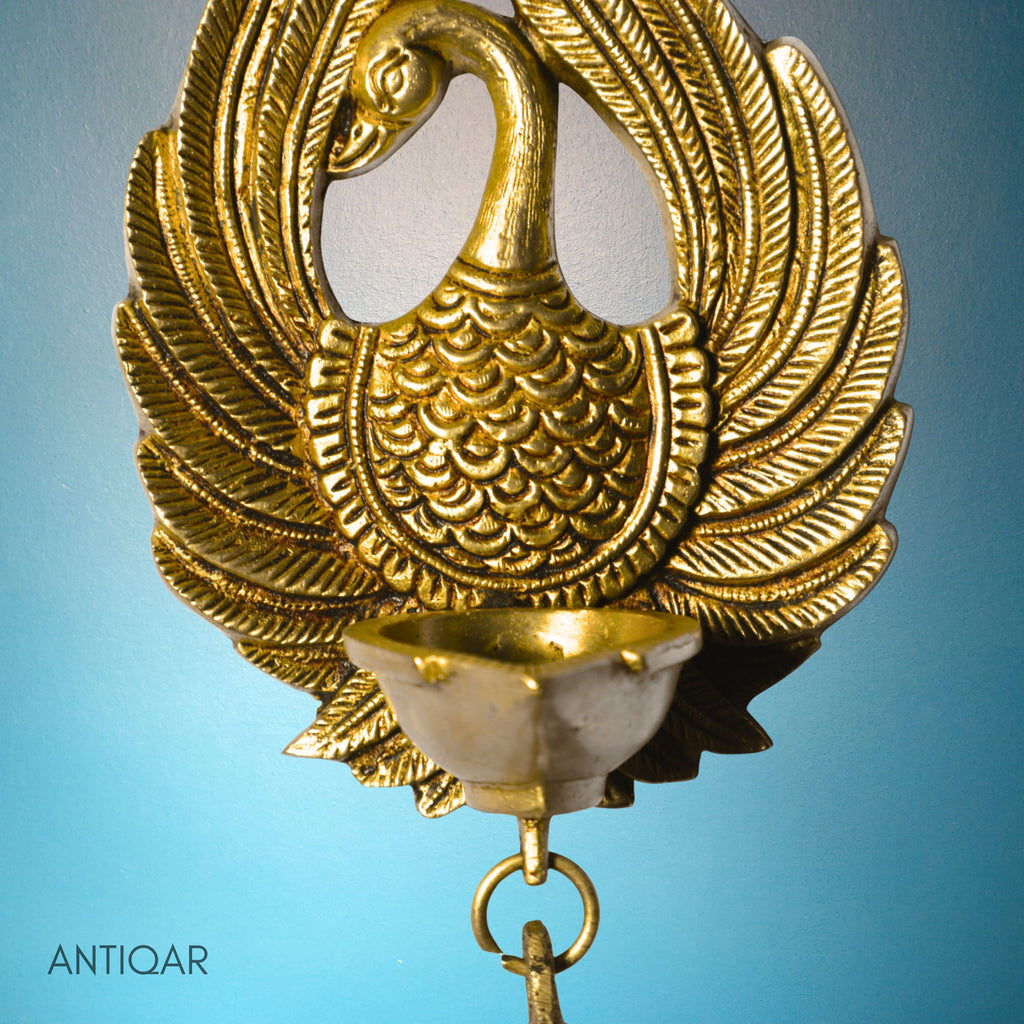 Brass Dancing Peacock Wall Hanging Diya – 23 cm | With One Bell & Intricate Carving | Antique Golden Finish | Handcrafted Decor for Temple, Home & Wall