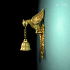 Brass Parrot Wall Hanging – 26 cm | Sitting on Tree Holding Designer Bell | Antique Golden Finish | Handcrafted Decor for Temple, Home & Wall