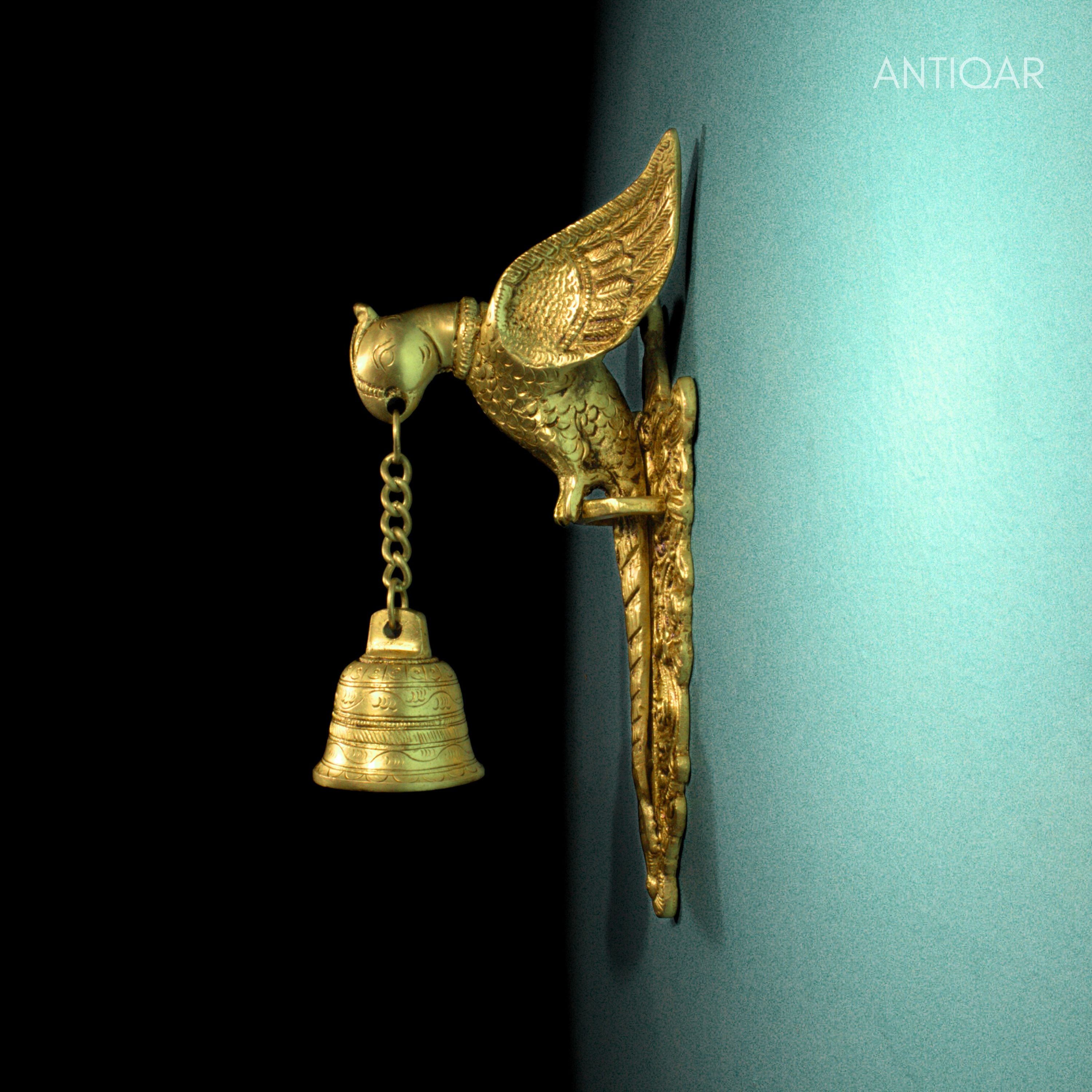 Brass Parrot Wall Hanging – 26 cm | Sitting on Tree Holding Designer Bell | Antique Golden Finish | Handcrafted Decor for Temple, Home & Wall