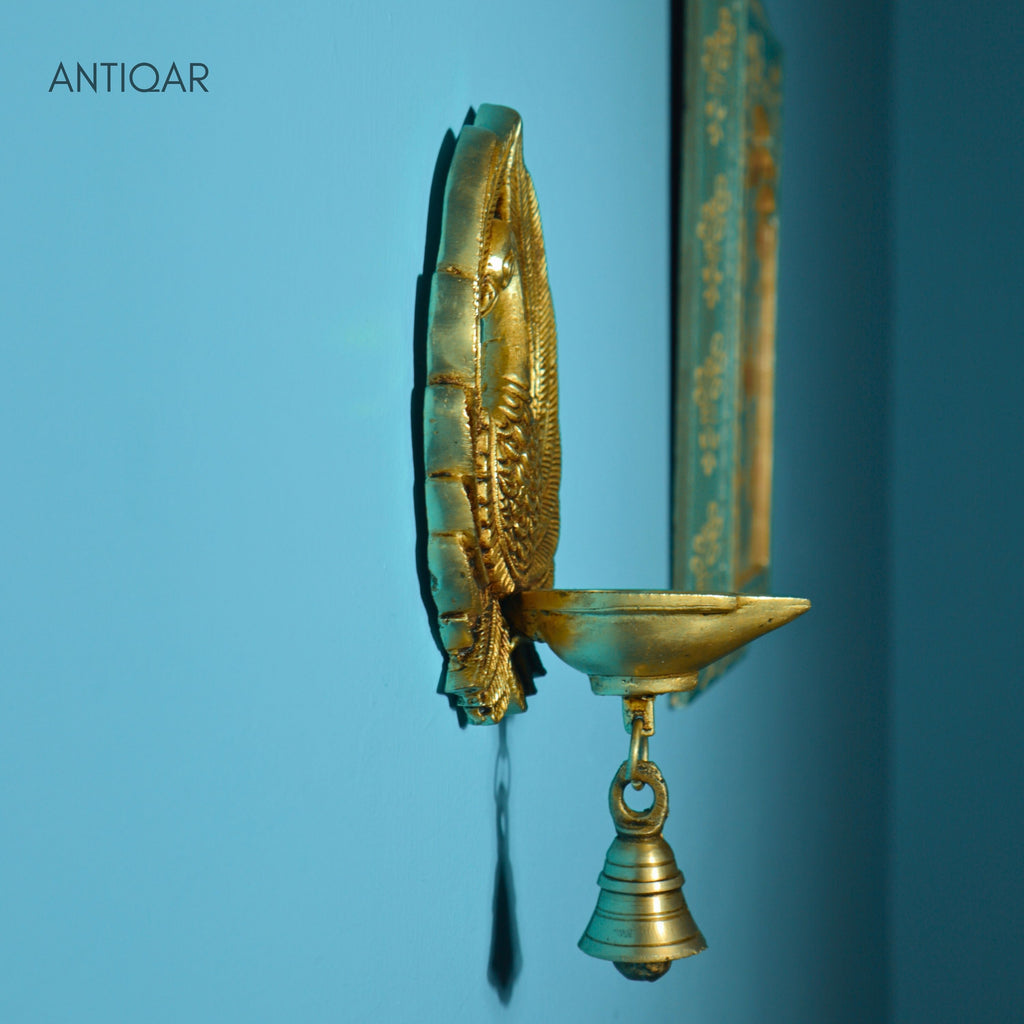 Brass Dancing Peacock Wall Hanging Diya – 23 cm | With One Bell & Intricate Carving | Antique Golden Finish | Handcrafted Decor for Temple, Home & Wall