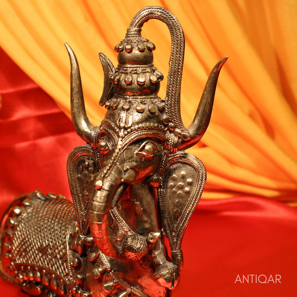 Dhokra Art Brass Nandi – 22 cm | Sitting Pose with Ganesha Face & Trishul on Head | Antique Finish Tribal Handcrafted Showpiece for Temple, Home & Table Decor