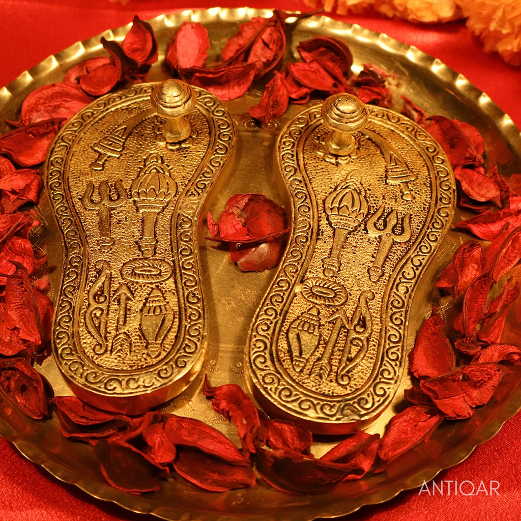 Brass Charan Paduka Pair – 3 cm | With Carved Talwar, Dhanush, Trishul & Chakra | Antique Golden Finish | Handcrafted Spiritual Decor for Temple, Home & Festival Use