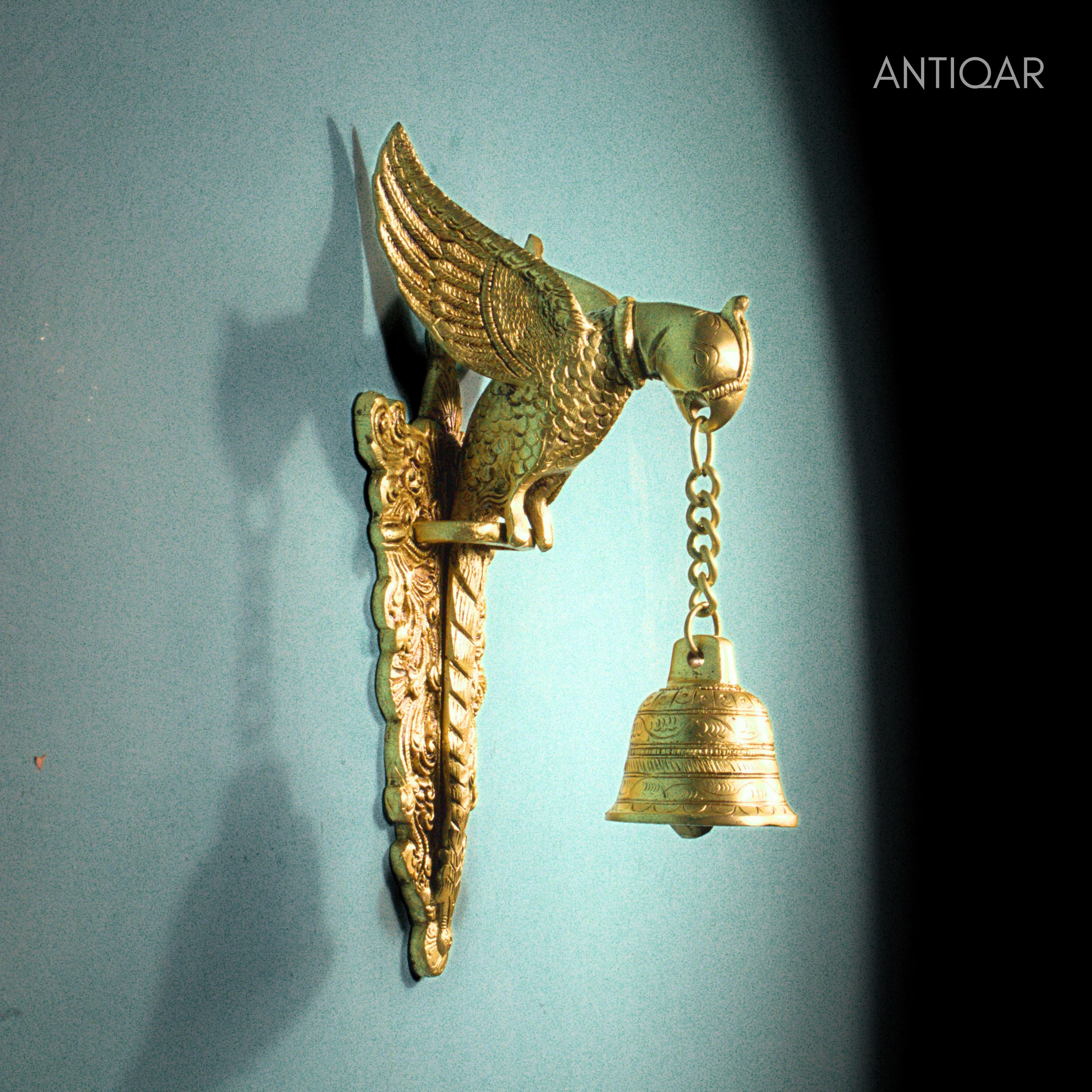 Brass Parrot Wall Hanging – 26 cm | Sitting on Tree Holding Designer Bell | Antique Golden Finish | Handcrafted Decor for Temple, Home & Wall