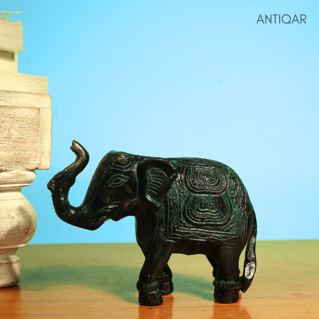 Brass Elephant Showpiece – 9 cm | Walking Pose with Upward Trunk & Carved Body | Black Green Patina Finish | Handcrafted Decor for Temple, Home & Table