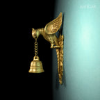 Brass Parrot Wall Hanging – 26 cm | Sitting on Tree Holding Designer Bell | Antique Golden Finish | Handcrafted Decor for Temple, Home & Wall