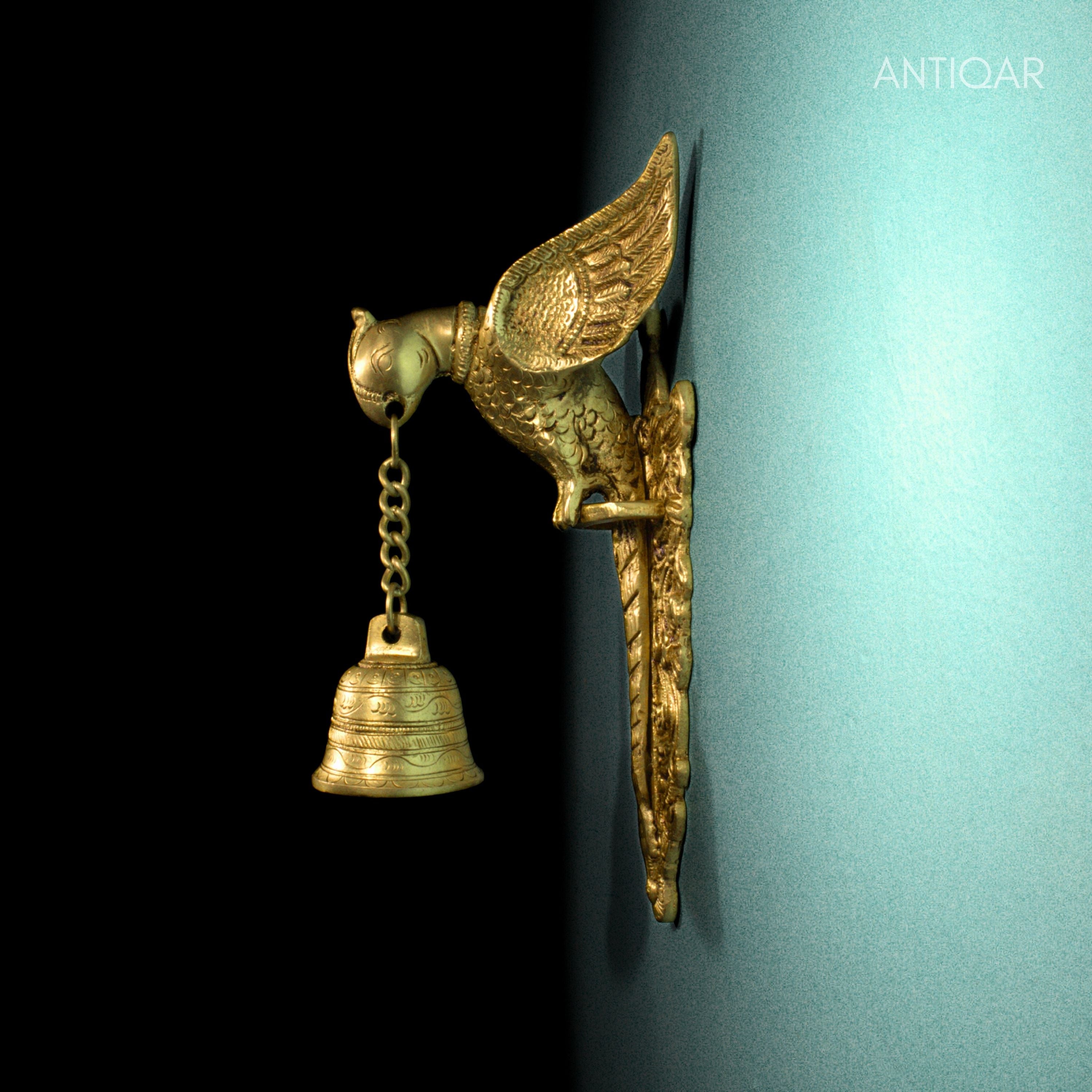 Brass Parrot Wall Hanging – 26 cm | Sitting on Tree Holding Designer Bell | Antique Golden Finish | Handcrafted Decor for Temple, Home & Wall
